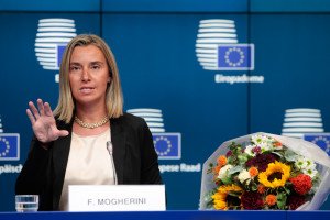 Federica Mogherini, next to a bunch of flowers