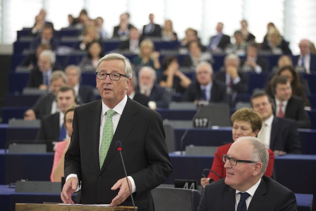 Speech by Jean-Claude Juncker, standing, in the presence of Frans Timmermans, First Vice-President designate of the EC in charge of Better Regulation, Inter-Institutional Relations, the Rule of Law and the Charter of Fundamental Rights, in the foreground, on the right
