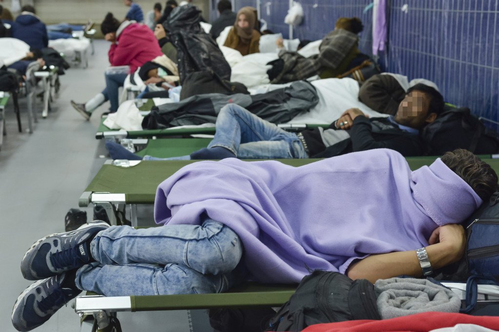 Refugees sleeping inside the migrant registration centre of Passau