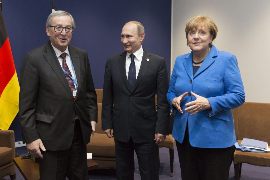 Jean-Claude Juncker, Vladimir Putin, President of Russia, and Angela Merkel, German Federal Chancellor (from left to right)