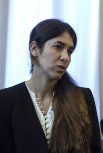 FILE - In this Wednesday, Dec. 30, 2015 file photo, Iraqi Yazidi Nadia Murad Basee Taha speaks with Greek President Prokopis Pavlopoulos during a meeting in Athens. An Islamic State rape victim, Pope Francis and the Afghan women's cycling team are among the known candidates for the 2016 Nobel Peace Prize as the nomination window was set to close Monday, Feb. 1, 2016. (AP Photo/Yorgos Karahalis, File)