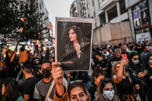 protester-holds-a-portrait-of-mahsa-amini-during-a-news-photo-1663859127 Mahsa Amini
